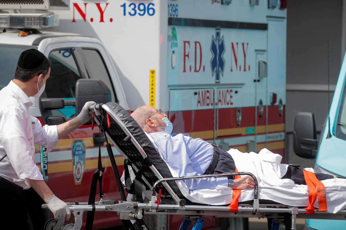 A patient arrives outside Maimonides Medical Center