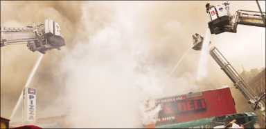 Raging fire roars through retail strip on 14th St. 21 fire1-2009-06-01_z