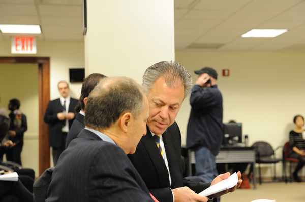 Council weighing Seaport plan 2 Chris Curry of The Howard Hughes Corp. confers with his firm's attorney, Paul Selver, on March 14, before the hearing was moved to the City Council chambers. Downtown Express photo by Terese Loeb Kreuzer