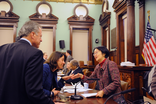 Council OKs Seaport plan with food markets 1 Councilmember Margaret Chin shakes hands with Julie Greenberg, a lobbyist for South Street Seaport Limited Partnership, which is part of Howard Hughes Corp. Looking on is Christopher Curry, senior executive vice president of the Hughes firm. Downtown Express photo by Terese Loeb Kreuzer