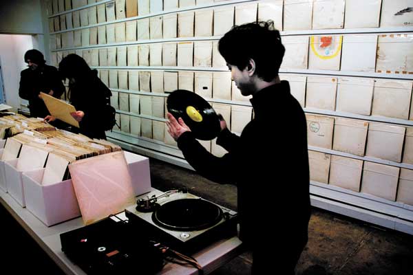 Play it again, Rutherford; He wants ‘White Album’s 3 Photos by Bob Krasner Rutherford Chang recorded one of the hundreds of “White Album”s from his collection for a master disc he’s creating.