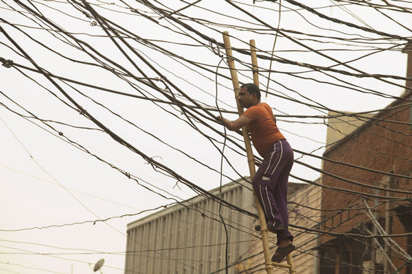 ‘Powerless’ of particular relevance, post-Sandy 3 Photo by Egon Johann Vencour Power to the people: Loha Singh risks life and limb to supply the have-nots with electricity.