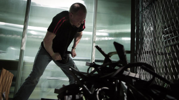 ‘Bending Steel’ an Unexpectedly Moving Documentary 2 Chris Schoeck, bending a horseshoe in his storage unit. Photo by Ryan Scafuro
