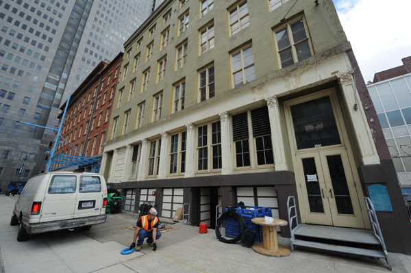 An electrician hired by E.D.C. outside the Seaport Museum's John St. building. Downtown Express photo by Terese Loeb Kreuzer