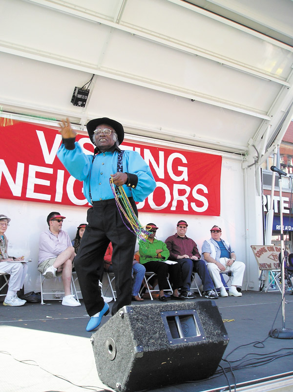At Visiting Neighbors Street Fair, Talent is Ageless 5 Photos courtesy of Visiting Neighbors Second Place winner Jim Porter throws Mardi Gras trinkets to the crowd.