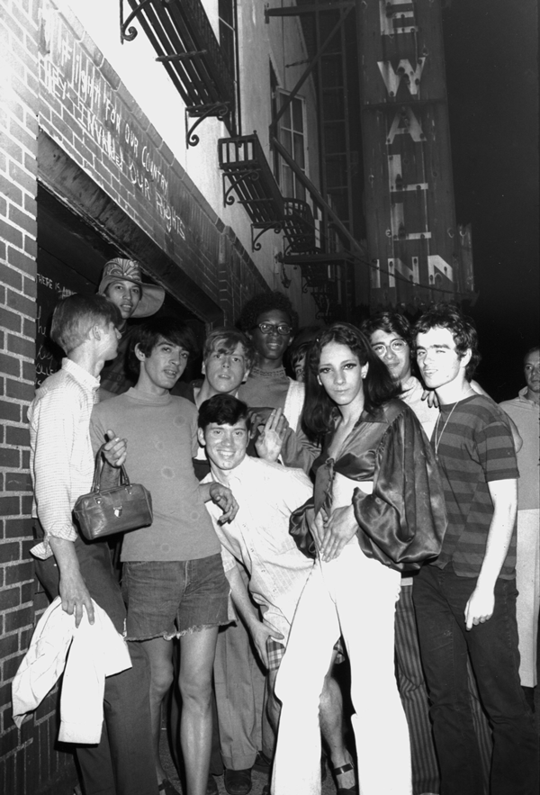 Put Me on Your Pride Plate 6 Courtesy of Steven Kasher Gallery, NY Fred W. McDarrah (1926-2007): “Celebration After Riots Outside Stonewall Inn, Nelly (Betsy Mae Koolo), Chris (Drag Queen Chris), Roger Davis, Michelle and Tommy Lanigan-Schmidt.” (RC Print, 1969. 8 1/2 x 5 1/2 inches).