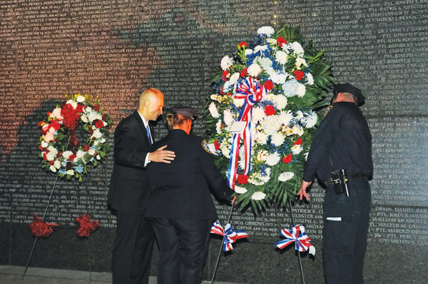 Before dawn every Sept. 11, some police quietly remember 1 Downtown Express photo by Terese Loeb Kreuzer As he has done for the last 12 years, retired N.Y.P.D. Lieutenant Paul Putkowski led a service between midnight and 1 a.m. on Sept. 11 at the Police Memorial in Battery Park City, this year darkened by Superstorm Sandy. Most of those who attend are, or were, affiliated with the N.Y.P.D.’s 61st precinct in Sheepshead Bay.