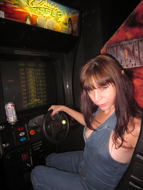 The Adventures of an Underemployed Urban Elf 2 At Two Bits arcade, Rev. Jen demonstrates the only way to drive drunk.