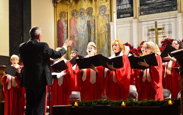 Community Activities: The Very Special Holiday Edition 4 Photo by Chris Kreussling (Flatbush Gardner) From 2012: Larry Long directs the Chelsea Community Church Candlelight Carol Service choir. The annual service happens this year on Dec. 15.