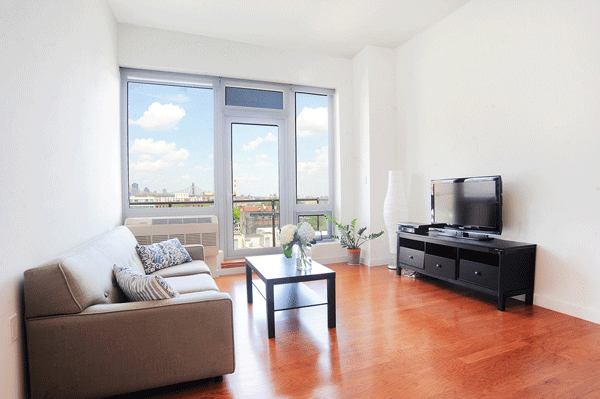 Long Island City: Skyline views fuel a boom 2 The living room of a one-bedroom condo at 5-49 Borden Ave. Town Residential