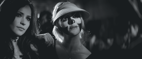 She alone breathes new life into the undead 1 Rome Shadanloo (left) floats through a characteristically atmospheric club scene. Courtesy Kino Lorber