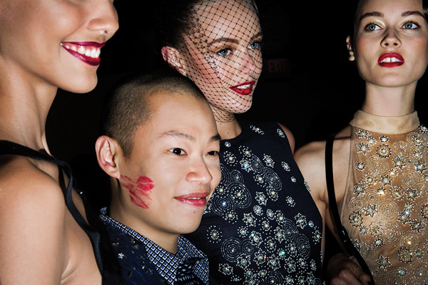 Designer Jason Wu and models pose for photographers after his Spring 2013 show in New York City.  Courtesy of Anastasia Photo ©Dina Litovsky