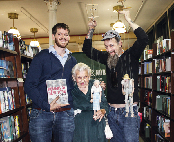 C.B. 2 member, activist icon...Human 2 Doris Diether, the legendary zoning maven of Community Board 2, and marionette master Ricky Syers — plus Little Doris and twerk-happy hillbilly Mr. Stix — joined Brandon Stanton, left, at the book signing for his new “Humans of New York Stories” at Barnes & Noble on E. 17th St. Tuesday evening. A photo of Diether and Syers is featured on the surefire bestseller’s back cover and they have a page inside.