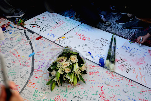 Uptown and Down, Manhattan Stands With Paris 4 With flowers and words, those gathered in Washington Square Park conveyed their love. | DONNA ACETO
