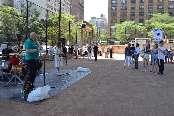 Parks Department, Community at Loggerheads on Queensboro Oval’s Future 1 Neighborhood residents gathered for a June rally demanding that Queensboro Oval be returned to full time public use when the current tennis club lease expires next August. | JACKSON CHEN