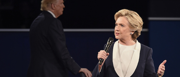 Hot mic, hard stop, vile threats: The week in Trump 1 In background, per diem zombie extra Donald Trump grabs a chair while locking down the creepy sociopath vote. Photo via hillaryclinton.com.