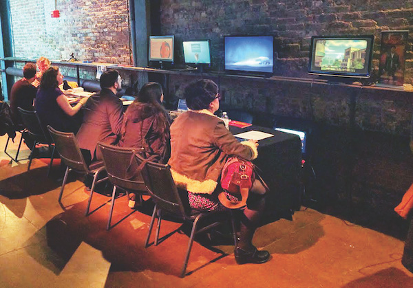 Con champions the artistic virtues of video games 4 A group engaged in the Games for Change section. Photo by Davis Cox.