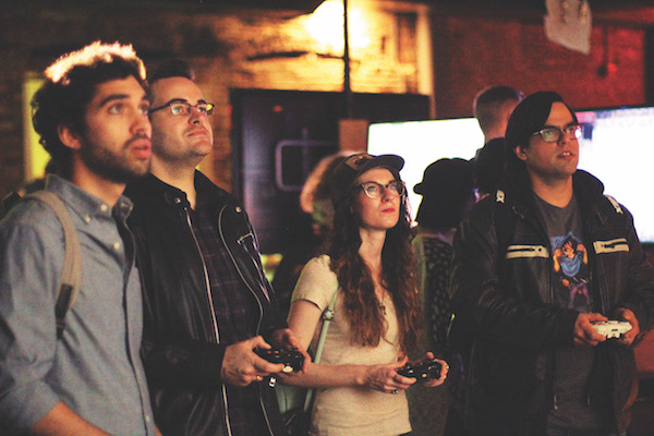 Con champions the artistic virtues of video games 2 And they’re still playing: Gamers from the 2015 ArtCade Con get a grip on things. Photo courtesy CultureHub.