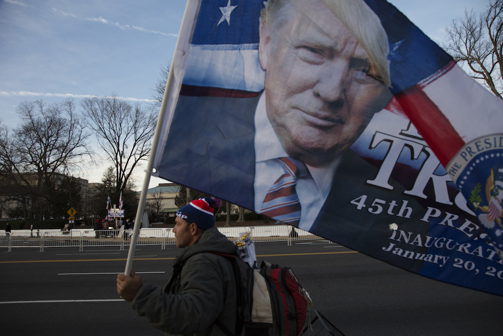 The inauguration...and the fate of the nation 8 Nick, 41 year old vendor from Florida, walks along the National Mall with a Trump flag, day before the inauguration.