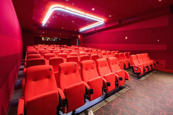 Each of the four screening rooms has a distinct color: blue, black, gray, and, seen here, red. Photo by Caleb Caldwell.