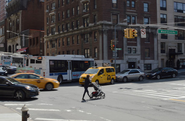 A pedestrian pushing precious cargo crosses West  96th Street at West End Avenue. | JACKSON CHEN 