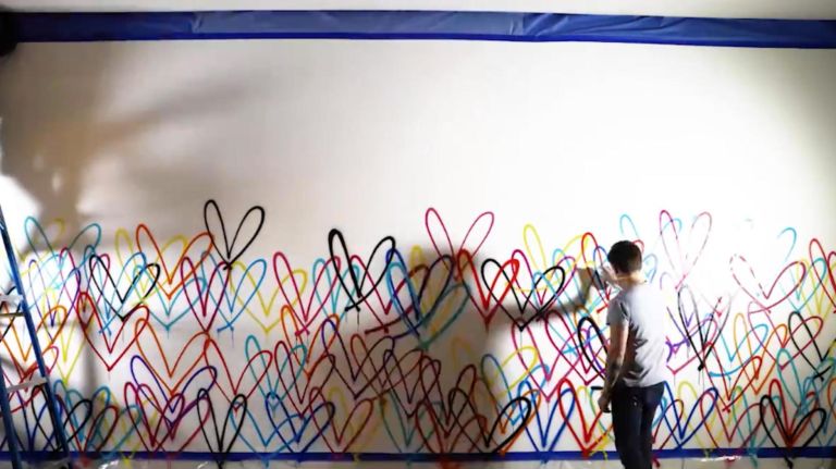 James Goldcrown paints his famous ‘Bleeding Hearts’ mural at Dream Downtown