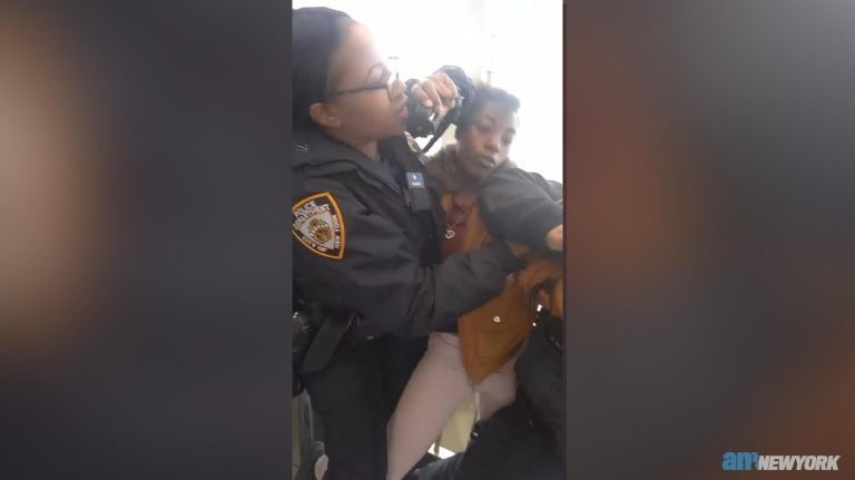Officer strikes woman multiple times during arrest in Queens, video shows 1 Officer strikes woman multiple times during arrest in Queens, video shows