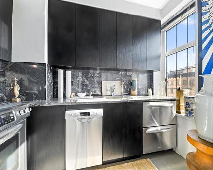 This unit at 465 W. 23rd St. is equipped with a modern kitchen