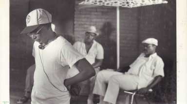 Spike Lee contemplates a scene on the set of 'Do The Right Thing', as three actors await his direction on July 25, 1988.
