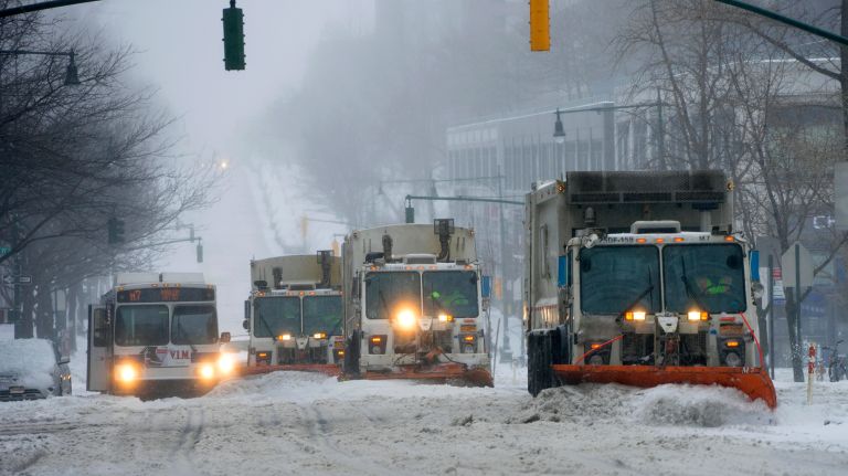 Plows make their way along Columbus Avenue during the snowstorm on the Upper West Side of Manhattan on Tuesday, March 14, 2017.