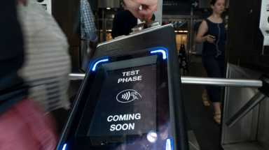 OMNY, pictured above at a Manhattan subway station, will be adopted across the PATH system by the end of 2022.