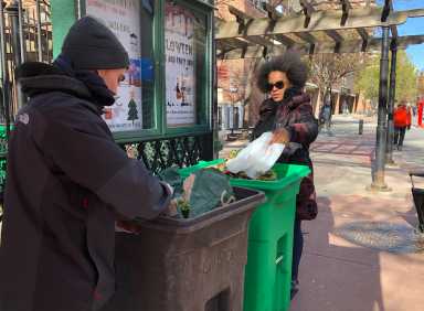 A Tribeca neighbor dumps her kitchen waste.