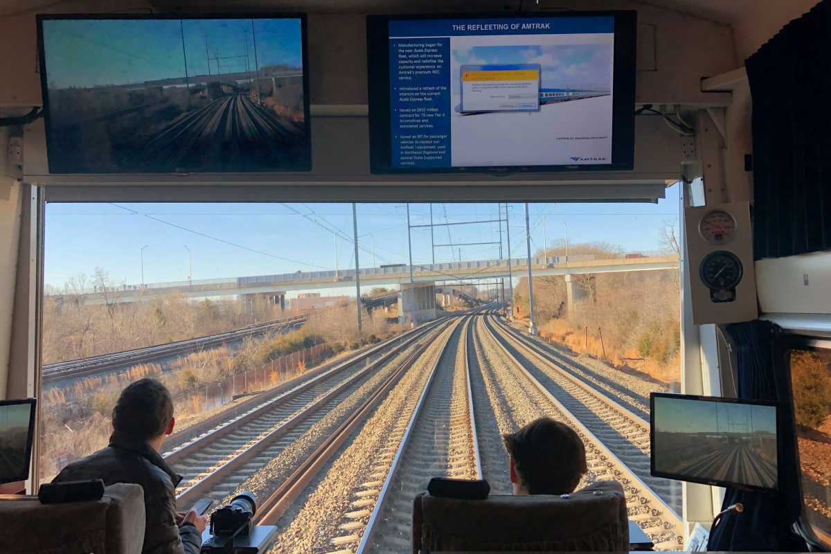 Members of the media ride on Amtrak train during a media tour along northeast rail corridor between Washington DC and New York City