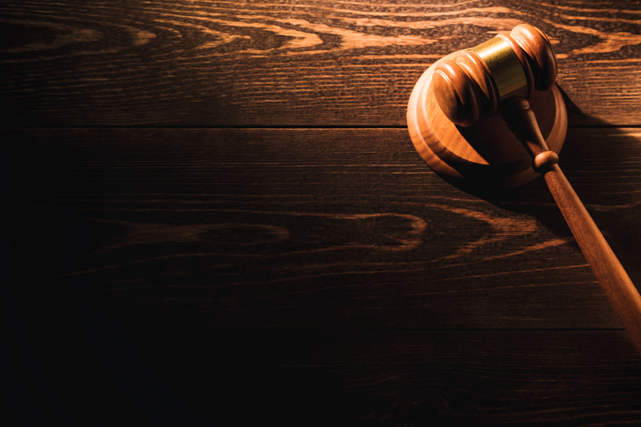 Wooden judge gavel hammer on wooden table background