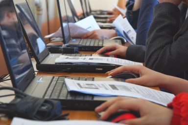 Students in a computer class. Students in front of computers in a computer class