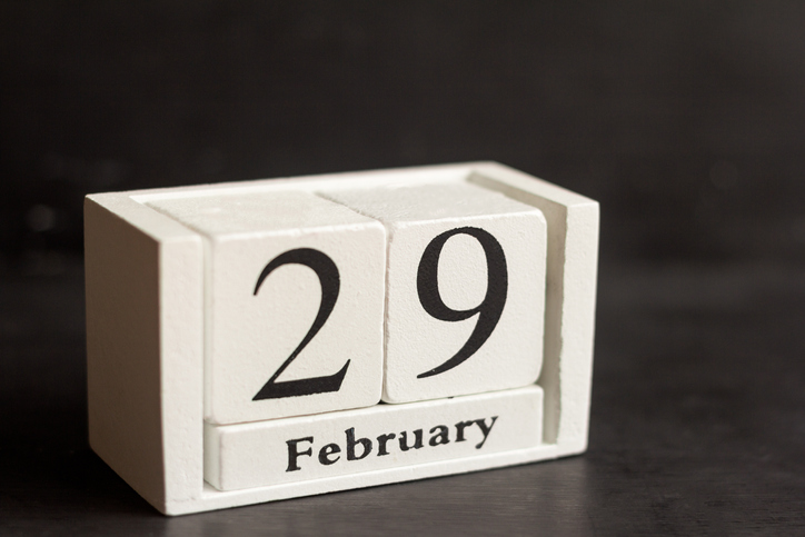 February 29 on a wooden calendar on a dark background .Calendar date, holiday event, or birthday.The last day of the winter month. February 29 happens every four years.