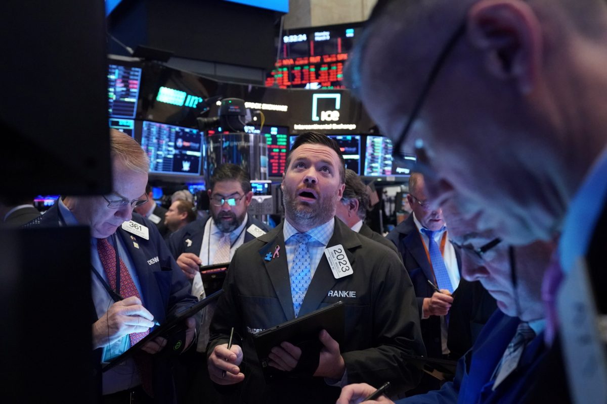 Traders work on the floor of the New York Stock Exchange