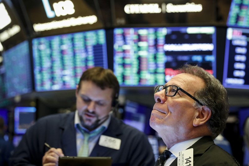 Traders work on the floor of the NYSE in New York