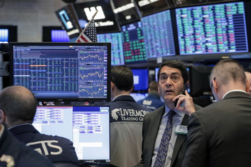 Traders work on the floor of the NYSE in New York