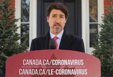 Canada’s Prime Minister Justin Trudeau speaks to news media outside his home in Ottawa