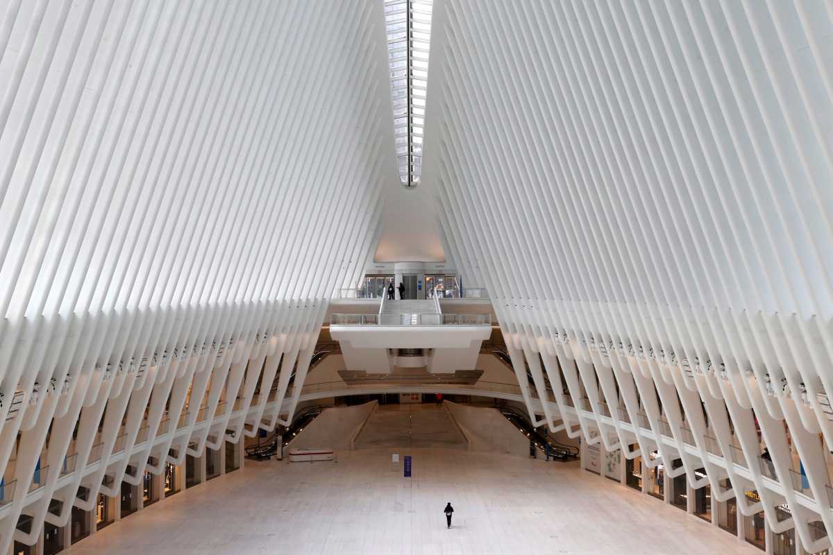 FILE PHOTO: Man walks alone through Oculus transportation hub during  outbreak of the coronavirus disease (COVID-19) in New York