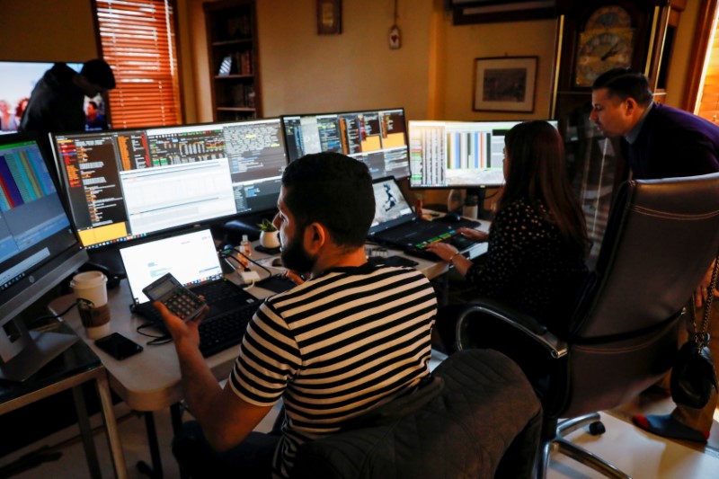 NYSE-AMEX Options floor traders from TradeMas Inc. work in an off-site trading office  due to the outbreak of the coronavirus disease (COVID-19), in New York