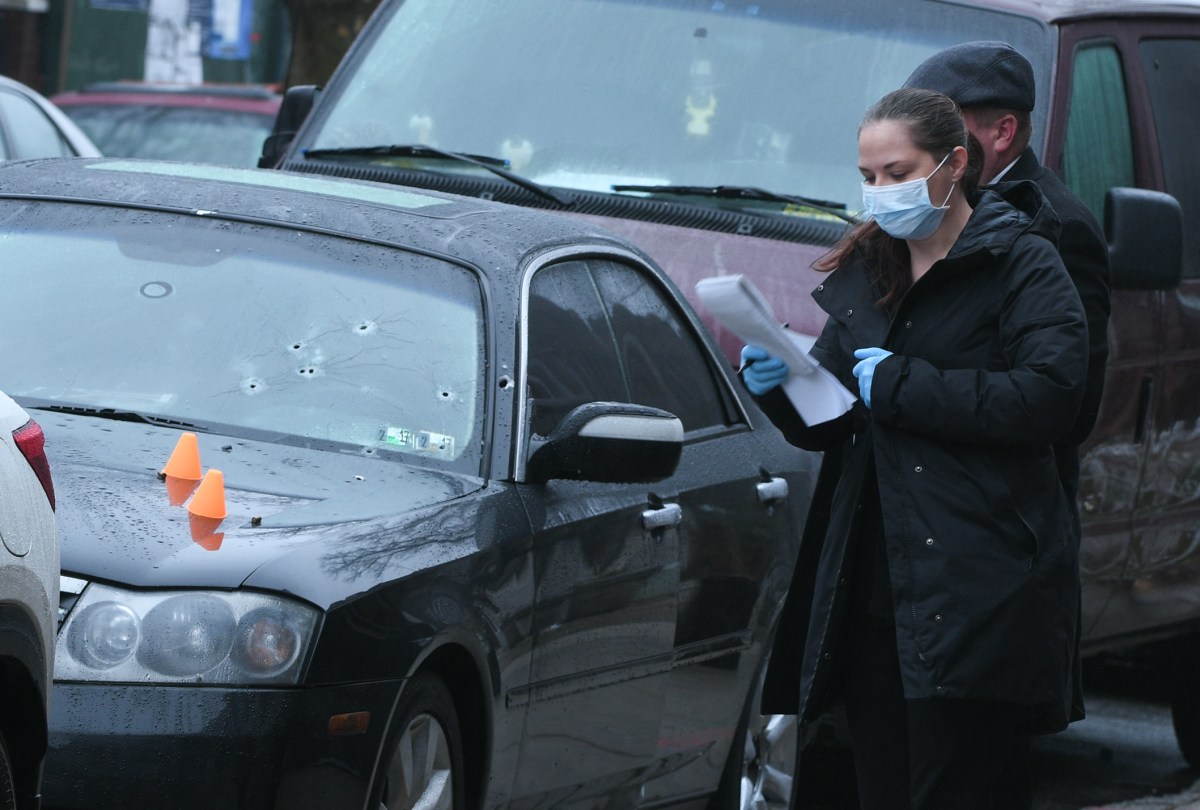 A NYPD Detective investgates a shooting on Rutlans Road and East 95 Street. on Sunday, March 29th.