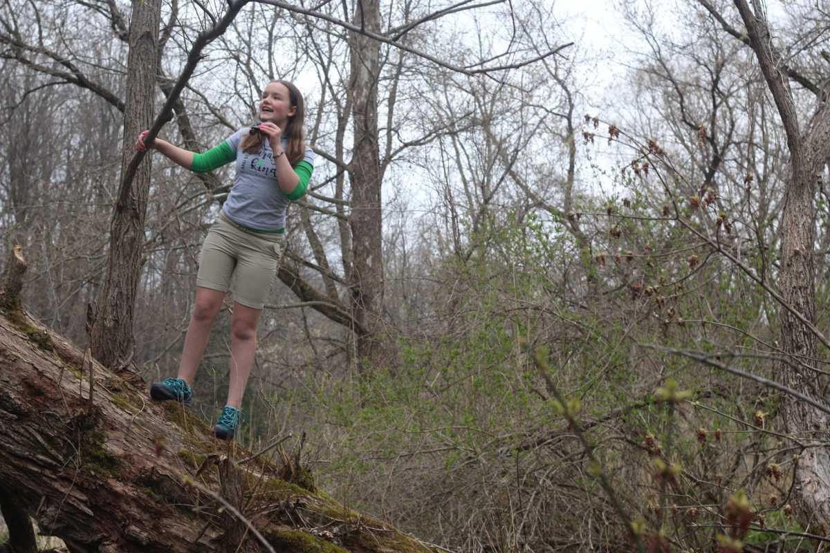 Jordan Miller, 11, birdwatches in her back yard in Manlius