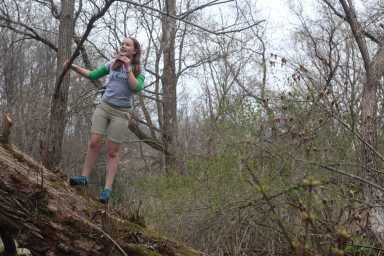 Jordan Miller, 11, birdwatches in her back yard in Manlius