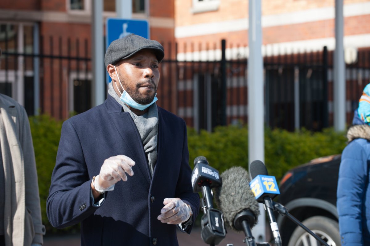 Community Member Chris Banks speaks during Nusing home rally