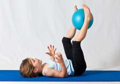 girl-in-white-shirt-and-black-pants-lying-on-blue-exercise-3992594-1200×849
