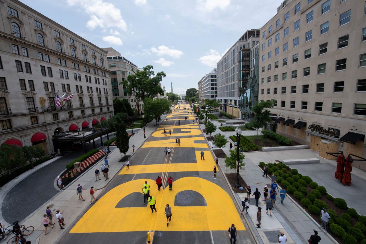 A Black lives matter sign is painted on a street in Washington, D.C.