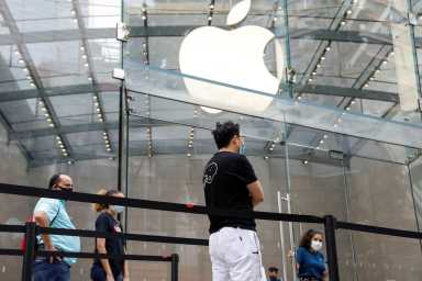Customers distance before entering an Apple Store during phase one of reopening after COVID-19 lockdown in New York City