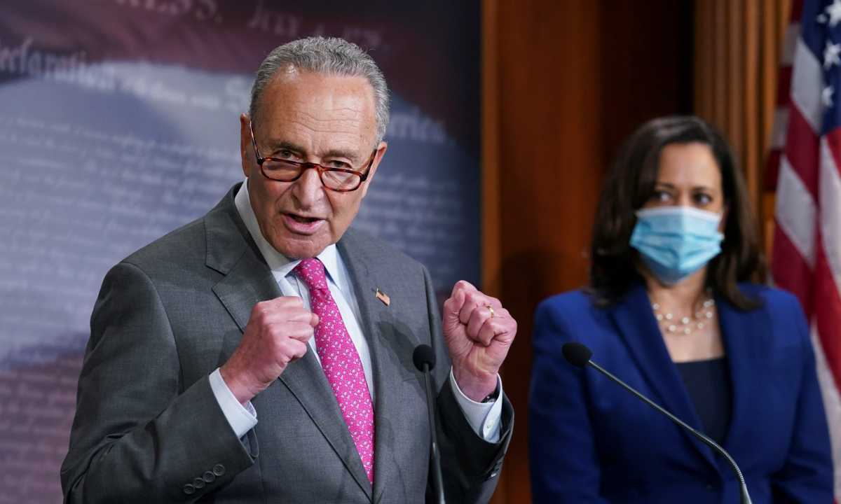 FILE PHOTO: Chuck Schumer and Kamala Harris speak on Capitol Hill in Washington